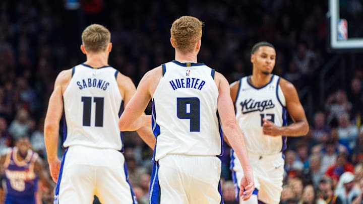 Nov 10, 2024; Phoenix, Arizona, USA; A general view of Sacramento Kings players forward-center Domantas Sabonis (11), guard-forward Kevin Huerter (9) and forward Keegan Murray (13) during the first half of a game against the Phoenix Suns at Footprint Center. Mandatory Credit: Allan Henry-Imagn Images