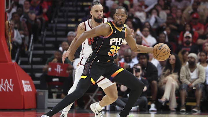 Mar 12, 2025; Houston, Texas, USA; Phoenix Suns forward Kevin Durant (35) controls the ball as Houston Rockets forward Dillon Brooks (9) defends during the third quarter at Toyota Center. Mandatory Credit: Troy Taormina-Imagn Images