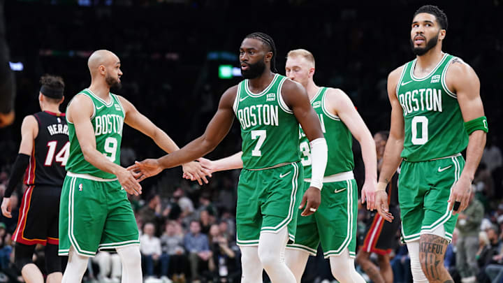 Apr 24, 2024; Boston, Massachusetts, USA; Boston Celtics guard Jaylen Brown (7), forward Jayson Tatum (0), guard Derrick White (9) and forward Sam Hauser (30) walk to the bench during a timeout against the Miami Heat in the second quarter during game two of the first round for the 2024 NBA playoffs at TD Garden. Mandatory Credit: David Butler II-Imagn Images