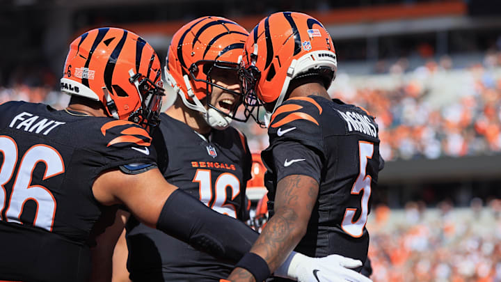 Oct 26, 2025; Cincinnati, Ohio, USA; Cincinnati Bengals wide receiver Tee Higgins (5) celebrates after scoring a touchdown with quarterback Joe Flacco (16) during the second quarter against the New York Jets at Paycor Stadium. Mandatory Credit: Katie Stratman-Imagn Images