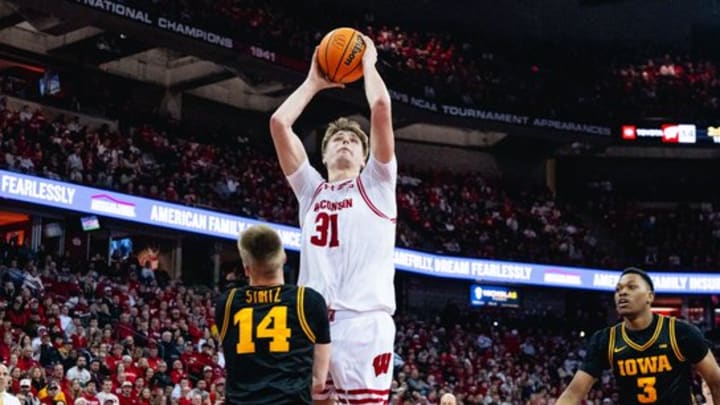 Wisconsin Badgers center Nolan Winter scores two of his 18 points in an 84-71 victory over the Iowa Hawkeyes. Wisconsin Badgers center Nolan Winter scores two of his 18 points in an 84-71 victory over the Iowa Hawkeyes.