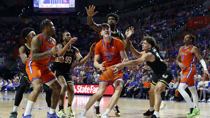 Feb 4, 2025; Gainesville, Florida, USA; Vanderbilt Commodores guard Chris Manon (30), forward Jaylen Carey (22) and forward Devin McGlockton (99) put pressure on Florida Gators forward Alex Condon (21) during the second half at Exactech Arena at the Stephen C. O'Connell Center. Mandatory Credit: Morgan Tencza-Imagn Images Feb 4, 2025; Gainesville, Florida, USA; Vanderbilt Commodores guard Chris Manon (30), forward Jaylen Carey (22) and forward Devin McGlockton (99) put pressure on Florida Gators forward Alex Condon (21) during the second half at Exactech Arena at the Stephen C. O'Connell Center. Mandatory Credit: Morgan Tencza-Imagn Images