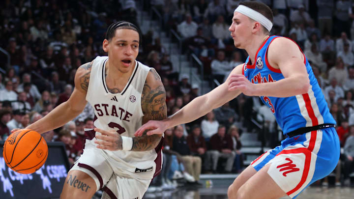 Jan 18, 2025; Starkville, Mississippi, USA; Mississippi State Bulldogs guard Riley Kugel (2) drives to the basket as Mississippi Rebels guard Sean Pedulla (3) defends during the second half at Humphrey Coliseum. Mandatory Credit: Petre Thomas-Imagn Images