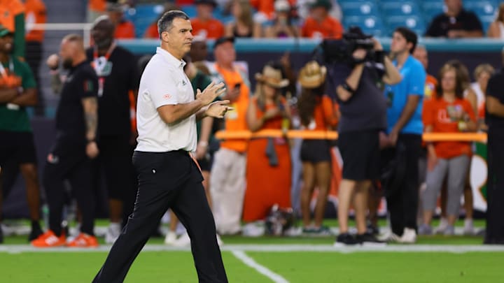 Oct 26, 2024; Miami Gardens, Florida, USA; Miami Hurricanes head coach Mario Cristobal reacts on the field before the game against the Florida State Seminoles at Hard Rock Stadium. Mandatory Credit: Sam Navarro-Imagn Images Oct 26, 2024; Miami Gardens, Florida, USA; Miami Hurricanes head coach Mario Cristobal reacts on the field before the game against the Florida State Seminoles at Hard Rock Stadium. Mandatory Credit: Sam Navarro-Imagn Images