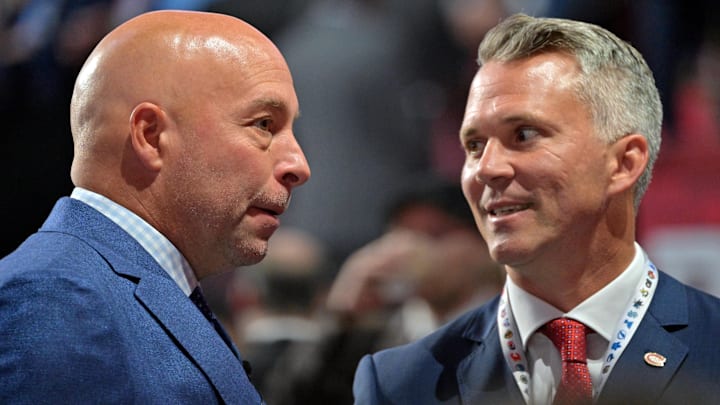 Jul 7, 2022; Montreal, Quebec, CANADA; Montreal Canadiens general manager Kent Hughes (left) talks with head coach Martin St. Louis before the first round of the 2022 NHL Draft at Bell Centre. Mandatory Credit: Eric Bolte-Imagn Images Jul 7, 2022; Montreal, Quebec, CANADA; Montreal Canadiens general manager Kent Hughes (left) talks with head coach Martin St. Louis before the first round of the 2022 NHL Draft at Bell Centre. Mandatory Credit: Eric Bolte-Imagn Images