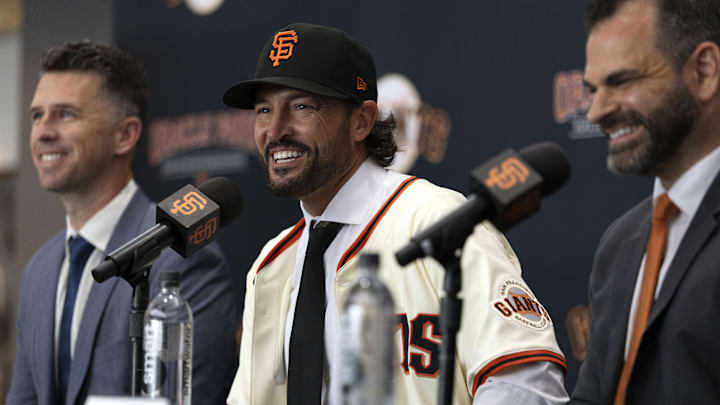 Tony Vitello (center) answers questions from the media as he is introduced as the new manager of the San Francisco Giants.