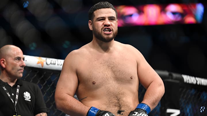 Sep 3, 2022; Paris, FRANCE;  Tai Tuivasa (blue gloves) is introduced before fighting Ciryl Gane