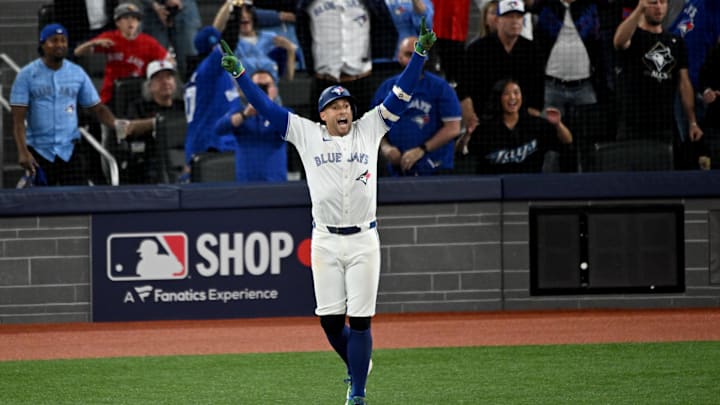 Oct 20, 2025; Toronto, Ontario, CAN; Toronto Blue Jays right fielder George Springer (4) celebrates as he runs the bases after hitting a three run home run against the Seattle Mariners in the seventh inning during game seven of the ALCS round for the 2025 MLB playoffs at Rogers Centre. Mandatory Credit: Dan Hamilton-Imagn Images Oct 20, 2025; Toronto, Ontario, CAN; Toronto Blue Jays right fielder George Springer (4) celebrates as he runs the bases after hitting a three run home run against the Seattle Mariners in the seventh inning during game seven of the ALCS round for the 2025 MLB playoffs at Rogers Centre. Mandatory Credit: Dan Hamilton-Imagn Images
