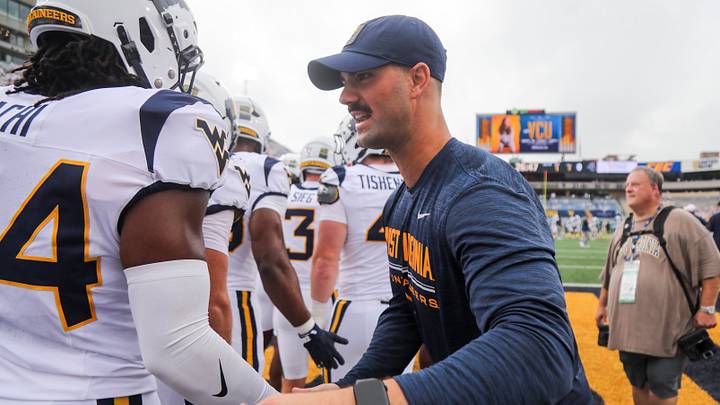 Sep 5, 2026; Morgantown, West Virginia, USA; West Virginia Mountaineers defensive coordinator Zac Alley during warmups before their game against the Coastal Carolina Chanticleers at Milan Puskar Stadium. Mandatory Credit: Ben Queen-Imagn Images Sep 5, 2026; Morgantown, West Virginia, USA; West Virginia Mountaineers defensive coordinator Zac Alley during warmups before their game against the Coastal Carolina Chanticleers at Milan Puskar Stadium. Mandatory Credit: Ben Queen-Imagn Images