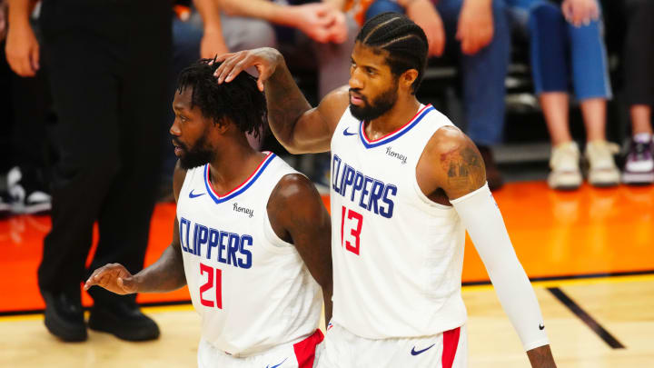 Jun 28, 2021; Phoenix, Arizona, USA; Los Angeles Clippers guard Paul George (13) and Patrick Beverley (21) against the Phoenix Suns in game five of the Western Conference Finals for the 2021 NBA Playoffs at Phoenix Suns Arena. Mandatory Credit: Mark J. Rebilas-USA TODAY Sports