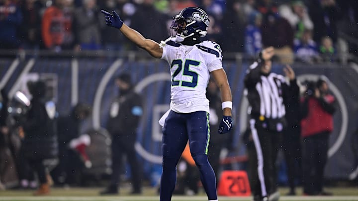 Dec 26, 2024; Chicago, Illinois, USA; Seattle Seahawks running back Kenny McIntosh (25) signals first down after a run against the Chicago Bears during the first quarter at Soldier Field. Mandatory Credit: Daniel Bartel-Imagn Images Dec 26, 2024; Chicago, Illinois, USA; Seattle Seahawks running back Kenny McIntosh (25) signals first down after a run against the Chicago Bears during the first quarter at Soldier Field. Mandatory Credit: Daniel Bartel-Imagn Images