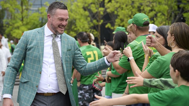 Sep 6, 2025; Eugene, Oregon, USA; Oregon Ducks head coach Dan Lanning greets fans before a game against the Oklahoma State Cowboys at Autzen Stadium. Mandatory Credit: Troy Wayrynen-Imagn Images
