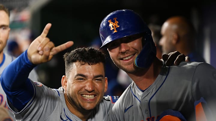 Jul 2, 2024; Washington, District of Columbia, USA; New York Mets second baseman Jose Iglesias (11) and first baseman Pete Alonso (20) pose for a photograph while celebrating in the dugout during the tenth inning against the Washington Nationals at Nationals Park. Mandatory Credit: Rafael Suanes-Imagn Images