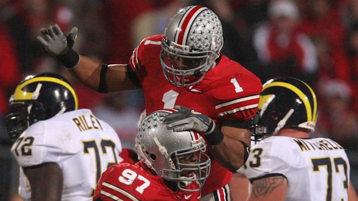 Nov 18, 2006; Columbus, OH, USA; Ohio State Buckeyes linebacker (1) Marcus Freeman celebrates a defensive stop with teammate defensive tackle (97) David Patterson against the Michigan Wolverines at Ohio Stadium. The Buckeyes beat the Wolverines 42-39. 