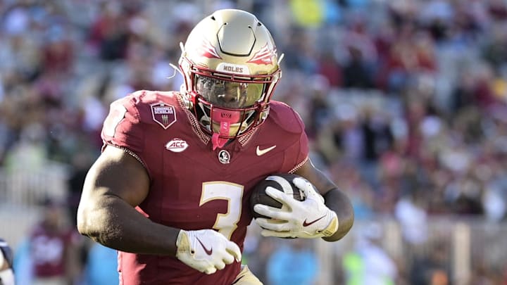 Nov 23, 2024; Tallahassee, Florida, USA; Florida State Seminoles running back Kam Davis (3) runs the ball during the second half of the game against the Charleston Southern Buccaneers.