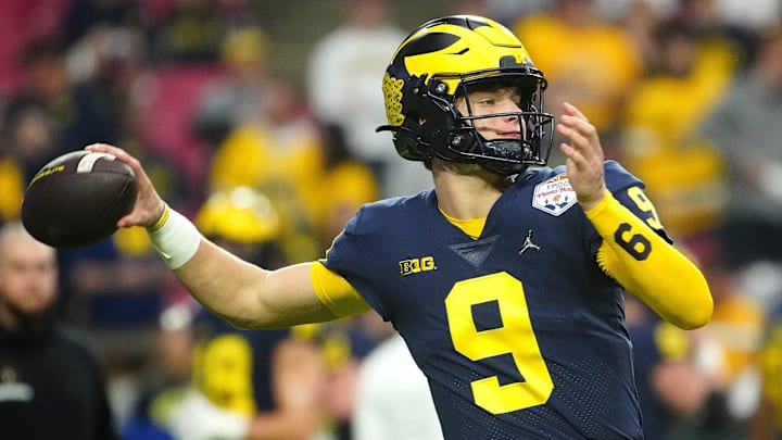 December 31, 2022; Glendale, Ariz; USA; Michigan quarterback JJ McCarthy (9) throws a pass during the pregame before the Fiesta Bowl at State Farm Stadium.

Ncaa Fiesta Bowl Game