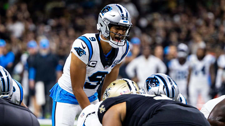 Sep 8, 2024; New Orleans, Louisiana, USA;  Carolina Panthers quarterback Bryce Young (9) calls a play at the line against the New Orleans Saints during the second half at Caesars Superdome. Mandatory Credit: Stephen Lew-Imagn ImagesNew Orleans Saints cornerback Will Harris (5)