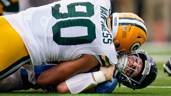 Tennessee Titans quarterback Will Levis (8) is sacked by Green Bay Packers defensive end Lukas Van Ness.