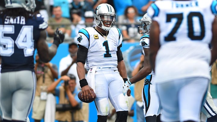 Carolina Panthers QB Cam Newton celebrates after scoring in the second quarter against the Dallas Cowboys.
