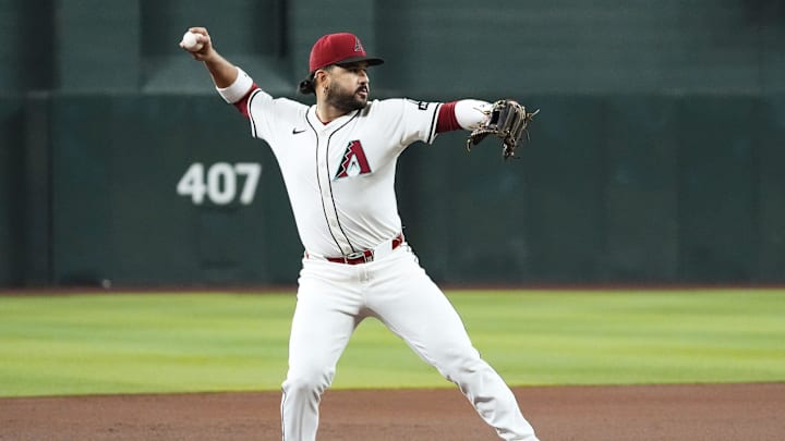 Arizona Diamondbacks third baseman Eugenio Suarez fields the ball and throws out Houston Astros' Yainer Diaz in the first inning at Chase Field in Phoenix on July 23, 2025.