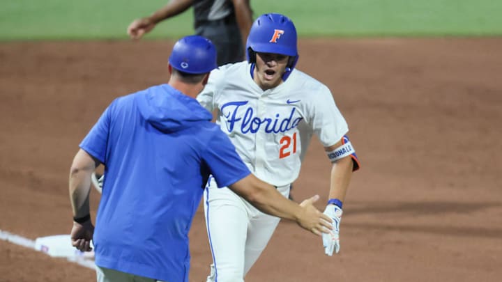 Florida Gators utility Caden McDonald rounds third base after hitting a home run against the Texas A&M Aggies.