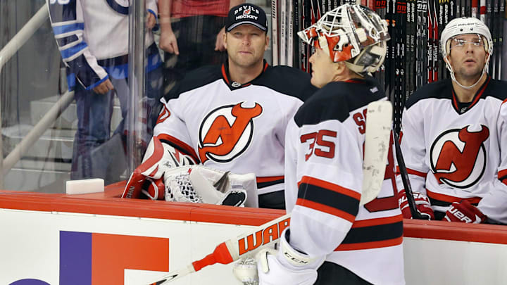 New Jersey Devils goalie Cory Schneider (35) speaks with goalie Martin Brodeur (30). Mandatory Credit: Bruce Fedyck-Imagn Images