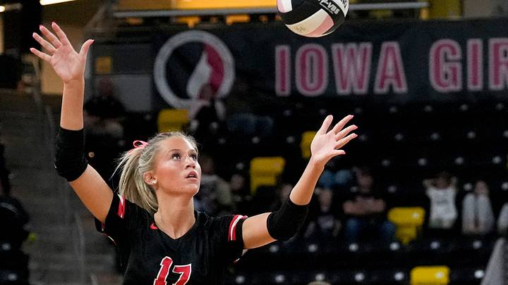 Davenport Assumption's Belle Cotton (17) serves to Humboldt Nov. 6, 2025 during a Class 3A Iowa high school state volleyball championship in Coralville, Iowa. Davenport Assumption's Belle Cotton (17) serves to Humboldt Nov. 6, 2025 during a Class 3A Iowa high school state volleyball championship in Coralville, Iowa.