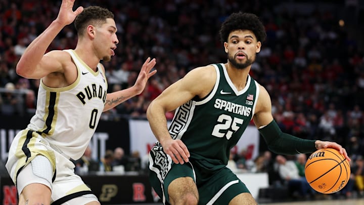 Mar 15, 2024; Minneapolis, MN, USA; Michigan State Spartans forward Malik Hall (25) works around Purdue Boilermakers forward Mason Gillis (0) during the second half at Target Center. Mandatory Credit: Matt Krohn-Imagn Images