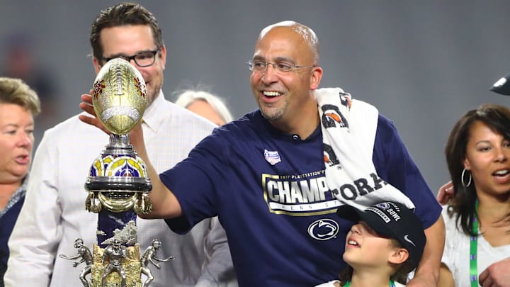 Penn State Nittany Lions head coach James Franklin celebrates with the trophy after defeating the Washington Huskies in the 2017 Fiesta Bowl at University of Phoenix Stadium. Penn State Nittany Lions head coach James Franklin celebrates with the trophy after defeating the Washington Huskies in the 2017 Fiesta Bowl at University of Phoenix Stadium.