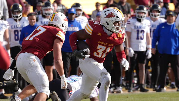Iowa State Cyclones' defensive back Marcus Neal Jr. runs with the ball after a interception against the Kansas Jayhawks. Iowa State Cyclones' defensive back Marcus Neal Jr. runs with the ball after a interception against the Kansas Jayhawks.