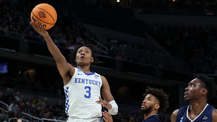 Mar 17, 2022; Indianapolis, IN, USA; Kentucky Wildcats guard TyTy Washington Jr. (3) shoots the ball against Saint Peter's Peacocks forward KC Ndefo (11) during the first round of the 2022 NCAA Tournament at Gainbridge Fieldhouse. Mandatory Credit: Trevor Ruszkowski-Imagn Images