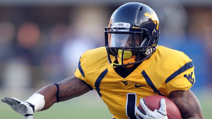 December 1, 2012; Morgantown, WV, USA; West Virginia Mountaineers wide receiver Tavon Austin (1) carries the ball against the Kansas Jayhawks during the third quarter at Milan Puskar Field. The West Virginia Mountaineers won 59-10. Mandatory Credit: Charles LeClaire-Imagn Images