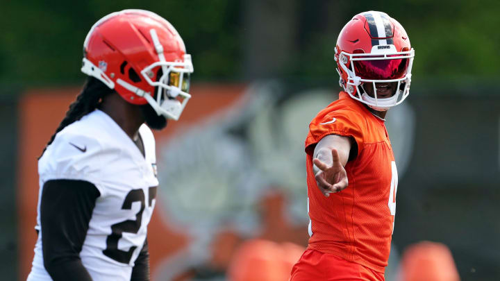 Browns quarterback Deshaun Watson signals to running back D'Onta Foreman during minicamp, Thursday, June 13, 2024, in Berea.