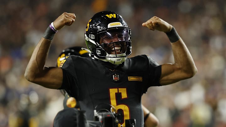 Washington Commanders quarterback Jayden Daniels (5) reacts after a play against the Chicago Bears during the second half at Northwest Stadium. 