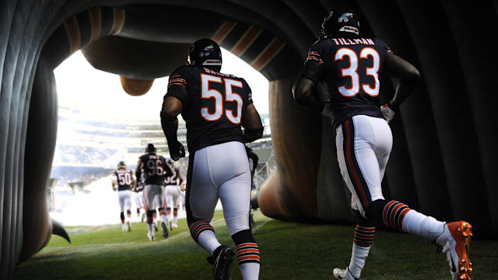 Aug 8, 2014; Chicago, IL, USA; Chicago Bears outside linebacker Lance Briggs (55) and cornerback Charles Tillman (33) enter the field against the Philadelphia Eagles during a preseason game at Soldier Field. Mandatory Credit: David Banks-Imagn Images