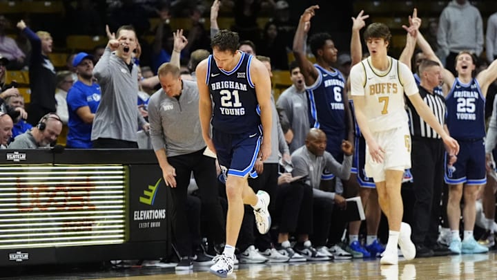 Jan 21, 2025; Boulder, Colorado, USA; Brigham Young Cougars guard Trevin Knell (21) reacts to a three point basket in the second half against the Colorado Buffaloes at CU Events Center. Mandatory Credit: Ron Chenoy-Imagn Images Jan 21, 2025; Boulder, Colorado, USA; Brigham Young Cougars guard Trevin Knell (21) reacts to a three point basket in the second half against the Colorado Buffaloes at CU Events Center. Mandatory Credit: Ron Chenoy-Imagn Images