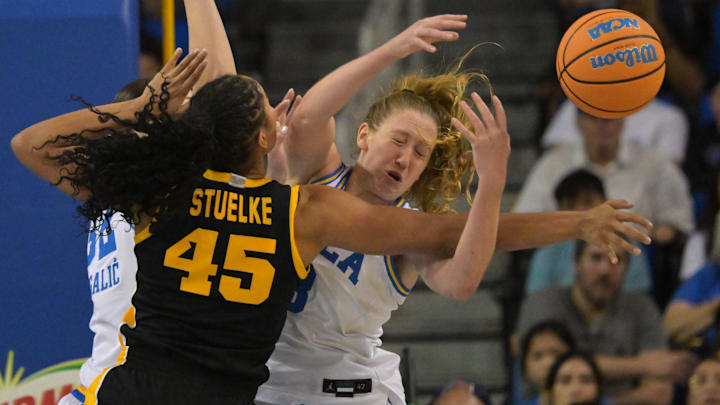 Feb 1, 2026; Los Angeles, California, USA; Iowa Hawkeyes forward Hannah Stuelke (45) and UCLA Bruins guard Gianna Kneepkens (8) reach for a loose ball in the first half at Pauley Pavilion presented by Wescom Financial. Mandatory Credit: Jayne Kamin-Oncea-Imagn Images Feb 1, 2026; Los Angeles, California, USA; Iowa Hawkeyes forward Hannah Stuelke (45) and UCLA Bruins guard Gianna Kneepkens (8) reach for a loose ball in the first half at Pauley Pavilion presented by Wescom Financial. Mandatory Credit: Jayne Kamin-Oncea-Imagn Images