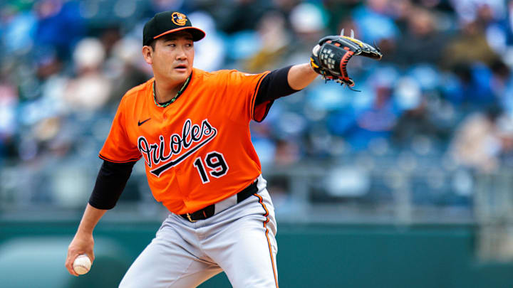 Apr 5, 2025; Kansas City, Missouri, USA; Baltimore Orioles pitcher Tomoyuki Sugano (19) pitches during the first inning against the Kansas City Royals at Kauffman Stadium.