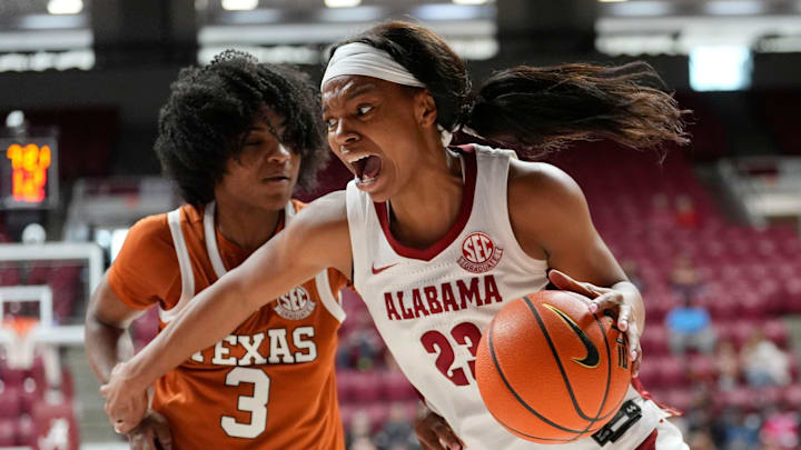 Mar 1, 2026; Tuscaloosa, AL, USA; Alabama guard Jessica Timmons (23) drives the baseline against Texas guard Rori Harmon (3) at Coleman Coliseum. Mandatory Credit: Gary Cosby Jr.-Tuscaloosa News