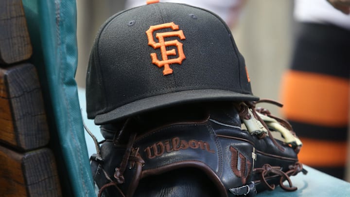 San Francisco Giants hat and glove on the bench against the Pittsburgh Pirates during the first inning at PNC Park. San Francisco Giants hat and glove on the bench against the Pittsburgh Pirates during the first inning at PNC Park.