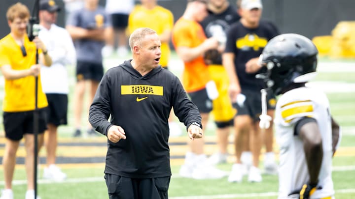 Aug 9, 2025; Iowa assistant head coach Seth Wallace talks with players during the Hawkeyes Kids Day NCAA football open practice at Kinnick Stadium in Iowa City, Iowa. Mandatory Credit: Joseph Cress for the Des Moines Register