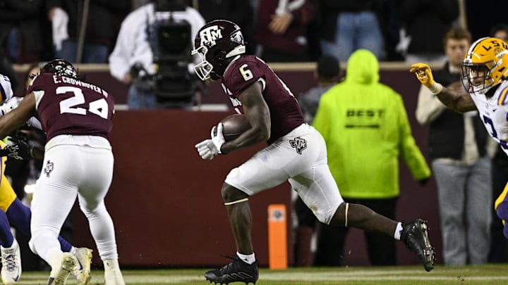 Nov 26, 2022; College Station, Texas, USA; Texas A&M Aggies running back Devon Achane (6) runs