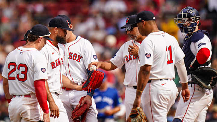 Aug 26, 2024; Boston, Massachusetts, USA; Boston Red Sox manager Alex Cora (13) hands off the ball to relief pitcher Luis Garcia (40) as they take on the Toronto Blue Jays in the eighth inning at Fenway Park. Mandatory Credit: David Butler II-Imagn Images Aug 26, 2024; Boston, Massachusetts, USA; Boston Red Sox manager Alex Cora (13) hands off the ball to relief pitcher Luis Garcia (40) as they take on the Toronto Blue Jays in the eighth inning at Fenway Park. Mandatory Credit: David Butler II-Imagn Images