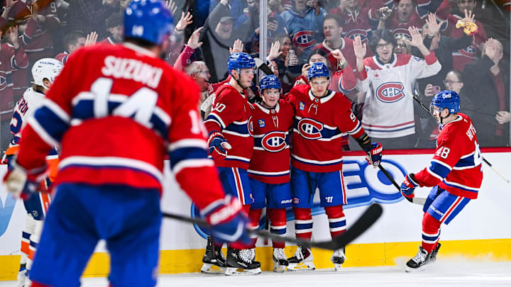 Mar 21, 2026; Montreal, Quebec, CAN; Montreal Canadiens right wing Cole Caufield (13) celebrates with eft wing Juraj Slafkovsky (20) and right wing Ivan Demidov (93) his third goal of the game against the New York Islanders during the third period at Bell Centre. Mandatory Credit: David Kirouac-Imagn Images Mar 21, 2026; Montreal, Quebec, CAN; Montreal Canadiens right wing Cole Caufield (13) celebrates with eft wing Juraj Slafkovsky (20) and right wing Ivan Demidov (93) his third goal of the game against the New York Islanders during the third period at Bell Centre. Mandatory Credit: David Kirouac-Imagn Images