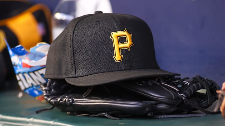 Sep 8, 2023; Atlanta, Georgia, USA; A detailed view of a Pittsburgh Pirates hat and glove before a game against the Pittsburgh Pirates in the first inning at Truist Park. Mandatory Credit: Brett Davis-Imagn Images