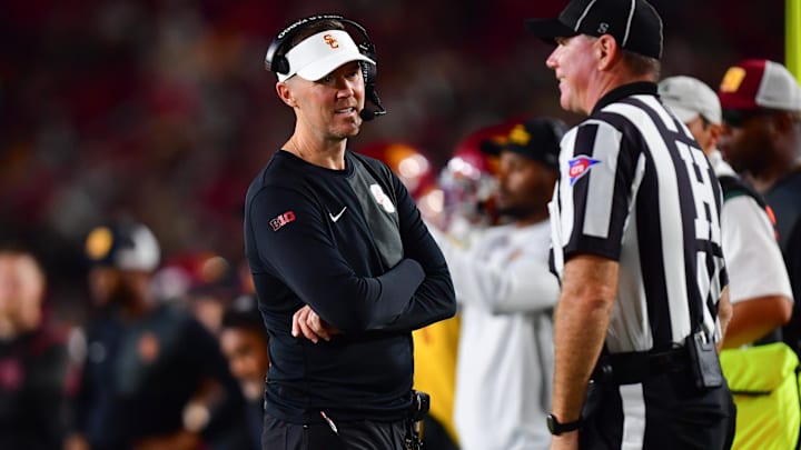 Sep 20, 2025; Los Angeles, California, USA; Southern California Trojans head coach Lincoln Riley speaks with the official during the second half at the Los Angeles Memorial Coliseum. Mandatory Credit: Gary A. Vasquez-Imagn Images