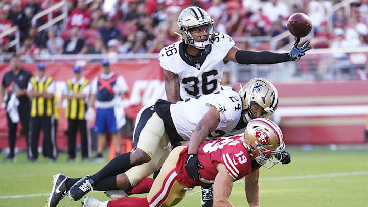 Aug 18, 2024; Santa Clara, California, USA; New Orleans Saints cornerback Rico Payton (36) reaches for the ball next to San Francisco 49ers wide receiver Trent Taylor (19) and safety Johnathan Abram (24) the second quarter at Levi's Stadium. Mandatory Credit: Cary Edmondson-USA TODAY Sports