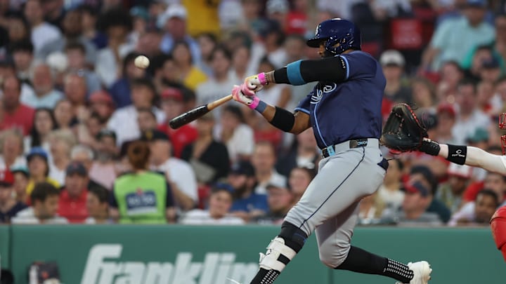 Jun 11, 2025; Boston, Massachusetts, USA; Tampa Bay Rays designated hitter Yandy Diaz (2) hits a two run home run during the fifth inning against the Boston Red Sox at Fenway Park. Mandatory Credit: Paul Rutherford-Imagn Images Jun 11, 2025; Boston, Massachusetts, USA; Tampa Bay Rays designated hitter Yandy Diaz (2) hits a two run home run during the fifth inning against the Boston Red Sox at Fenway Park. Mandatory Credit: Paul Rutherford-Imagn Images