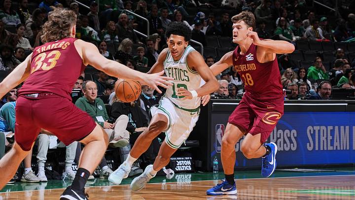 RJ Luis Jr. dribbles the ball during a Boston Celtics preseason game last year. He’s now returning to college basketball. 