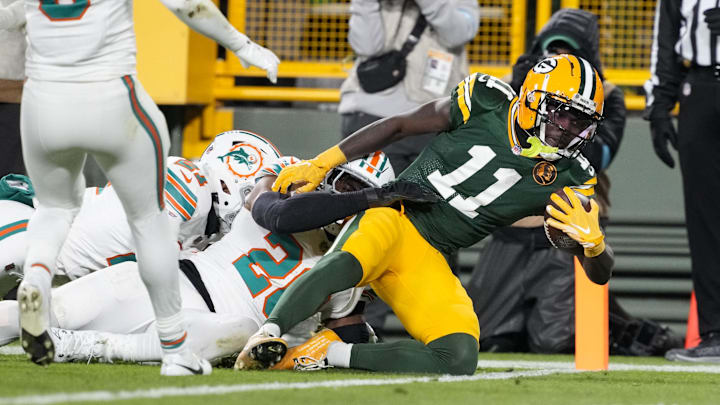 Green Bay Packers wide receiver Jayden Reed scores a touchdown during the second quarter against the Miami Dolphins.